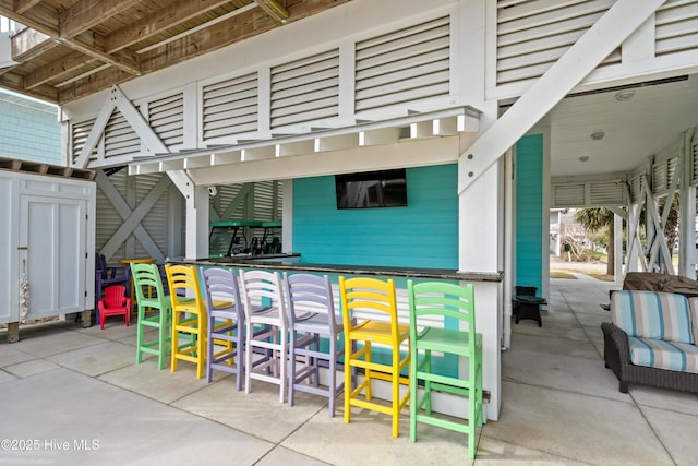 view of patio with outdoor dry bar