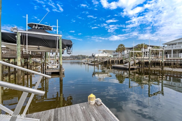 view of dock featuring a water view and boat lift