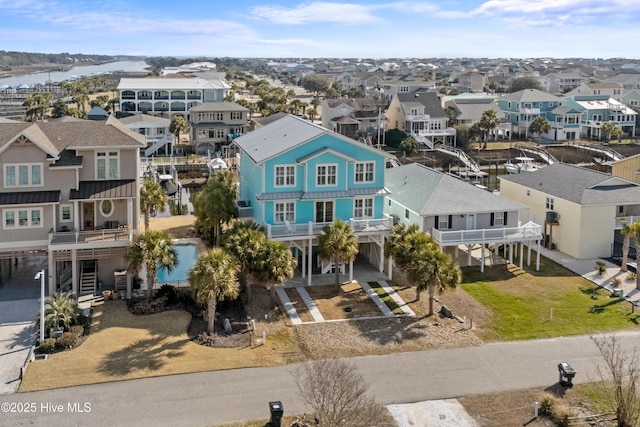 bird's eye view with a water view and a residential view