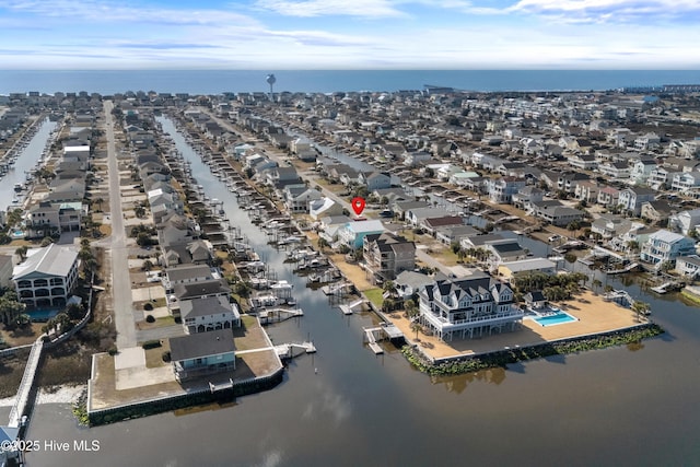 birds eye view of property featuring a water view and a residential view