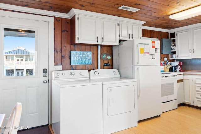 clothes washing area with light wood finished floors, visible vents, laundry area, wooden ceiling, and independent washer and dryer