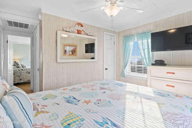 bedroom with ceiling fan, visible vents, and ornamental molding