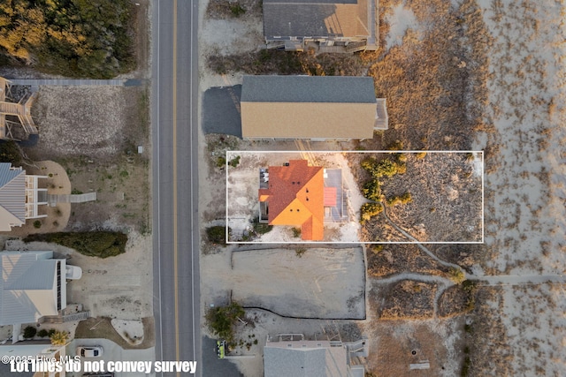 birds eye view of property with a residential view