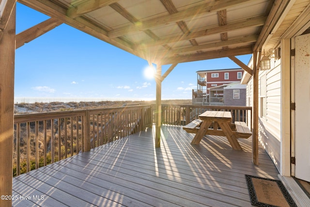 wooden deck featuring outdoor dining area