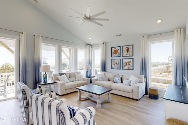 living room featuring recessed lighting, visible vents, light wood-style floors, ceiling fan, and high vaulted ceiling