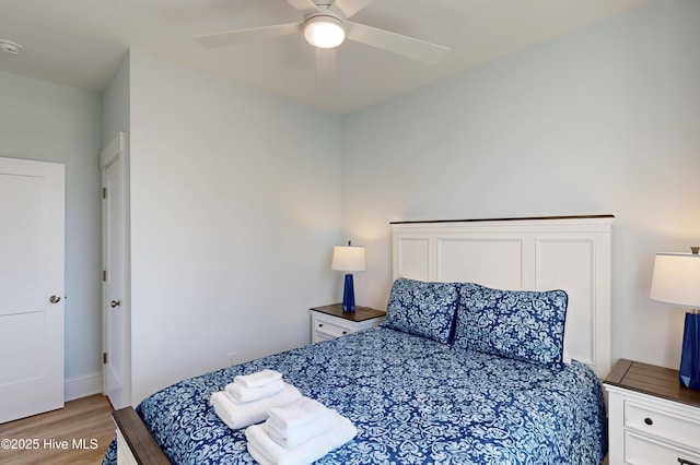 bedroom featuring a ceiling fan and light wood-type flooring