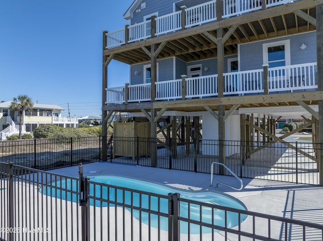 view of pool featuring a fenced in pool, fence, and a patio