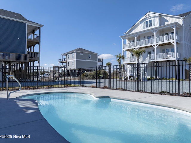 view of swimming pool with fence and a fenced in pool