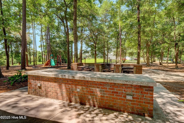 view of patio / terrace with playground community