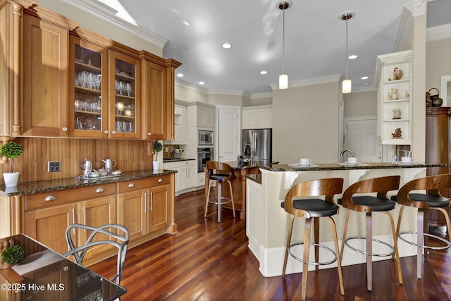 kitchen with stainless steel appliances, brown cabinets, dark stone counters, glass insert cabinets, and pendant lighting