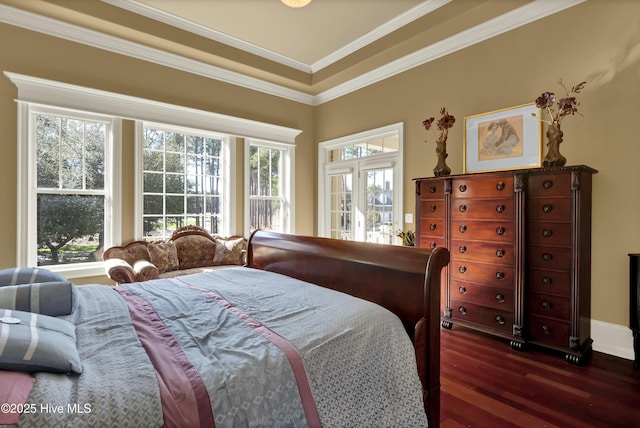 bedroom featuring dark wood finished floors and crown molding