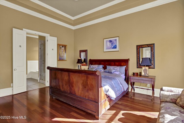 bedroom featuring wood finished floors and ornamental molding