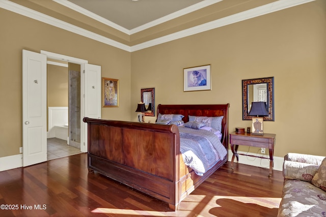 bedroom with crown molding and wood finished floors