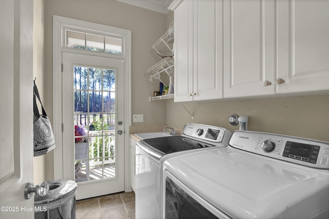 clothes washing area with crown molding, cabinet space, plenty of natural light, and separate washer and dryer