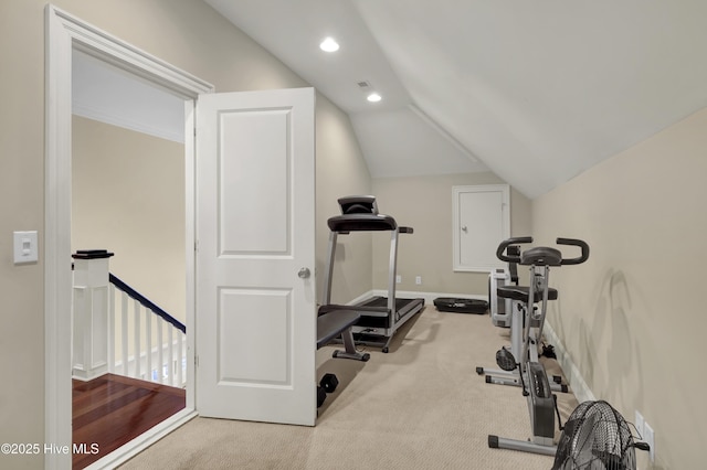 exercise room featuring light carpet, vaulted ceiling, baseboards, and recessed lighting