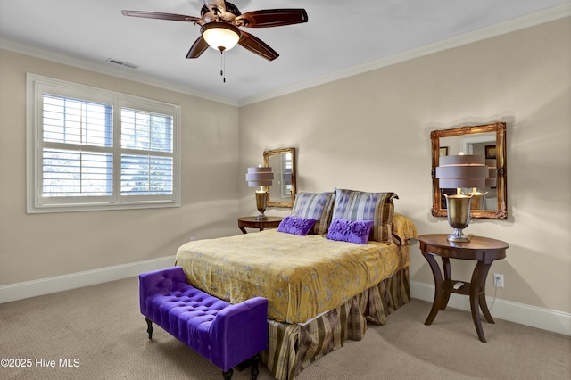 bedroom with ornamental molding, carpet flooring, visible vents, and baseboards