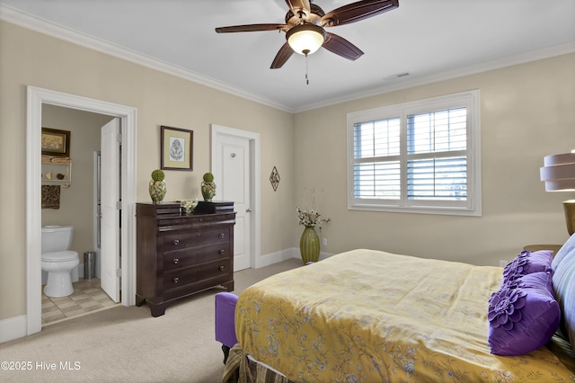 carpeted bedroom with crown molding, connected bathroom, baseboards, and ceiling fan