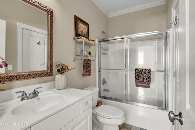 bathroom with ornamental molding, toilet, vanity, and shower / bath combination with glass door