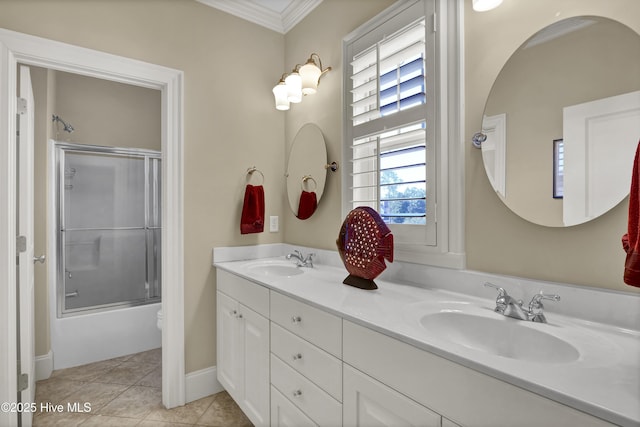 bathroom with crown molding, double vanity, tile patterned flooring, and bath / shower combo with glass door