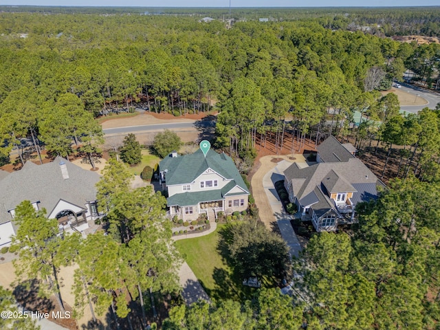 bird's eye view featuring a forest view