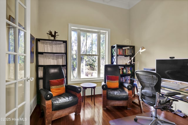 office space with wood finished floors, plenty of natural light, and crown molding