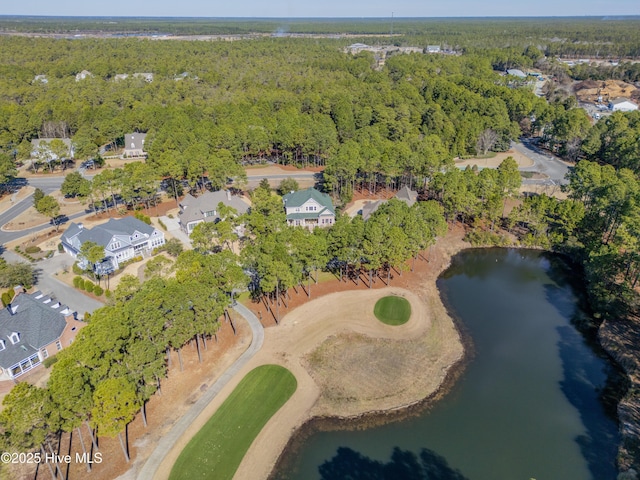 bird's eye view with a water view, a forest view, and view of golf course