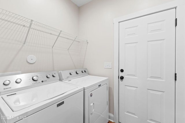 laundry room featuring laundry area and separate washer and dryer