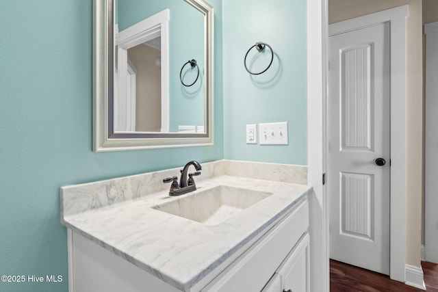 bathroom featuring vanity and wood finished floors