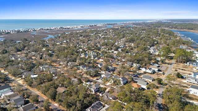 birds eye view of property with a water view and a residential view