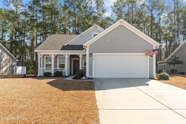 view of front of home with a garage, driveway, a porch, a front lawn, and board and batten siding