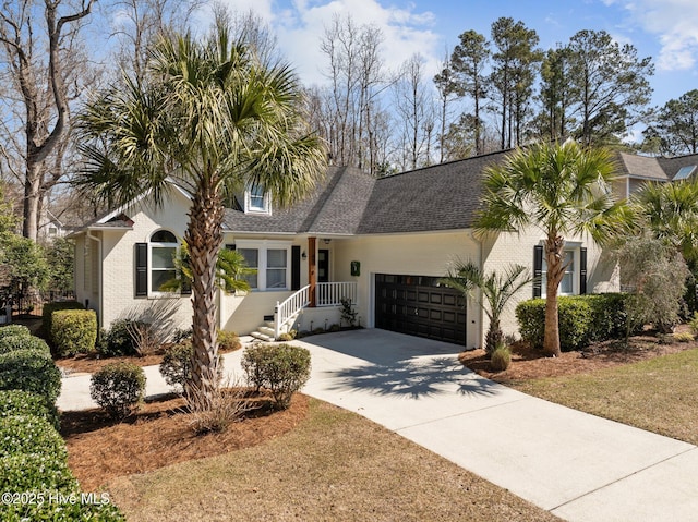 view of front of home featuring concrete driveway, a garage, brick siding, and roof with shingles