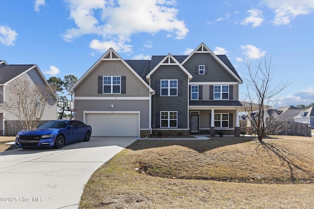 craftsman inspired home featuring driveway, stone siding, a garage, and fence