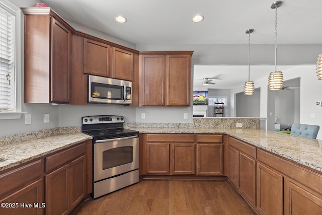 128 Pamlico Dr, Holly Ridge, NC 28445 - kitchen featuring dark wood-style floors, stainless steel appliances, hanging light fixtures, and recessed lighting