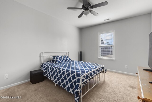 128 Pamlico Dr, Holly Ridge, NC 28445 - bedroom featuring carpet floors, a ceiling fan, visible vents, and baseboards