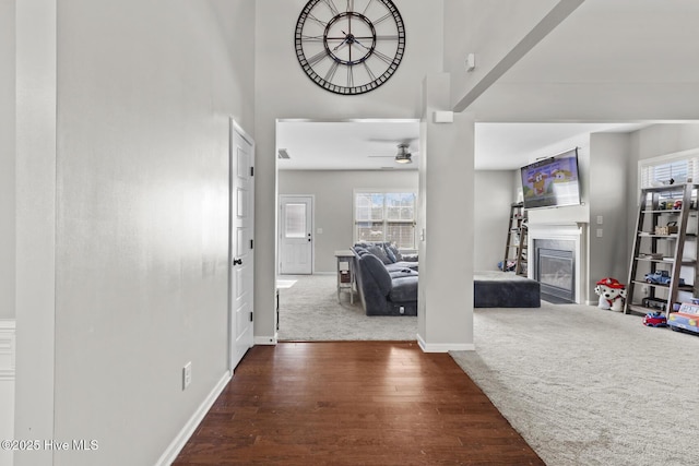 128 Pamlico Dr, Holly Ridge, NC 28445 - hall with a towering ceiling, carpet, baseboards, and wood finished floors