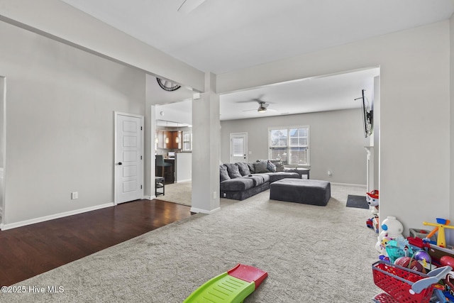 128 Pamlico Dr, Holly Ridge, NC 28445 - carpeted living area with a ceiling fan, baseboards, and wood finished floors