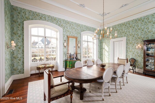 dining area featuring wallpapered walls, visible vents, baseboards, and dark wood finished floors