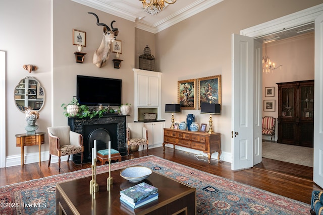 living room with ornamental molding, a notable chandelier, and dark wood-style floors