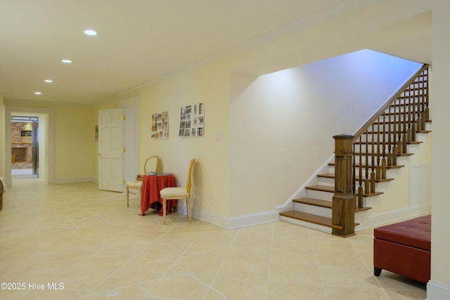 living area with baseboards, light tile patterned floors, recessed lighting, and crown molding