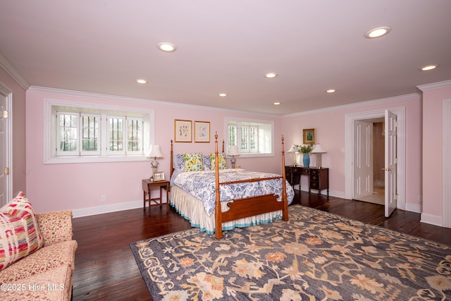 bedroom with baseboards, ornamental molding, and dark wood finished floors