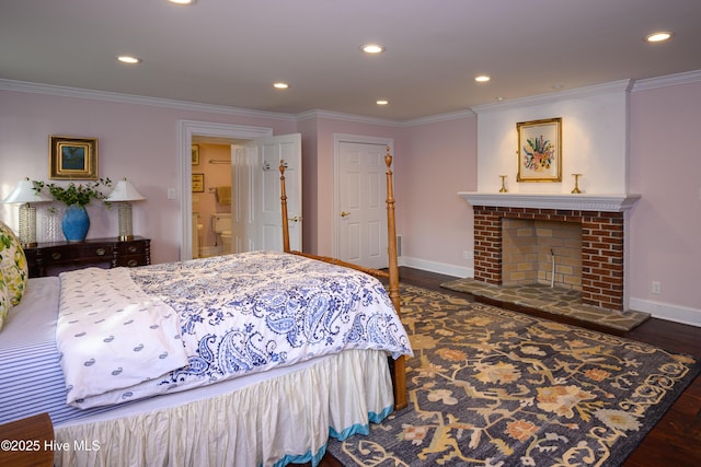 bedroom with dark wood-style flooring, a fireplace, recessed lighting, ornamental molding, and baseboards