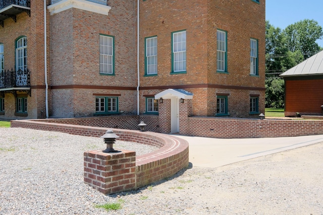 exterior space featuring brick siding