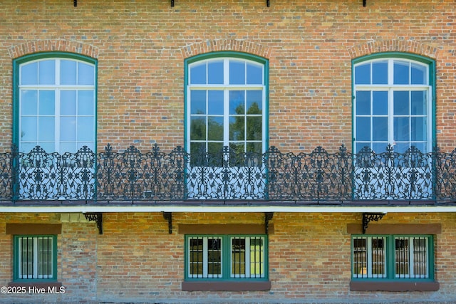 view of side of property with brick siding