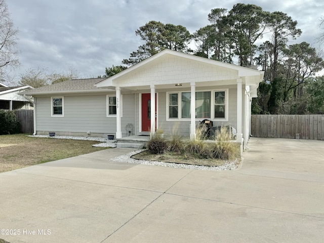 view of front of house featuring crawl space and fence