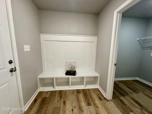 unfurnished bedroom featuring baseboards, visible vents, carpet floors, a tray ceiling, and multiple windows