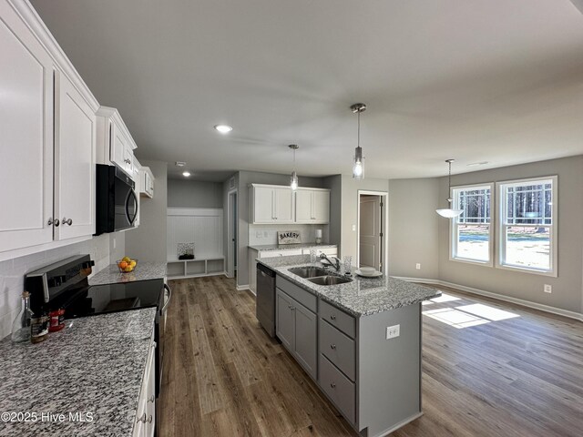 unfurnished dining area with visible vents, baseboards, and dark wood finished floors