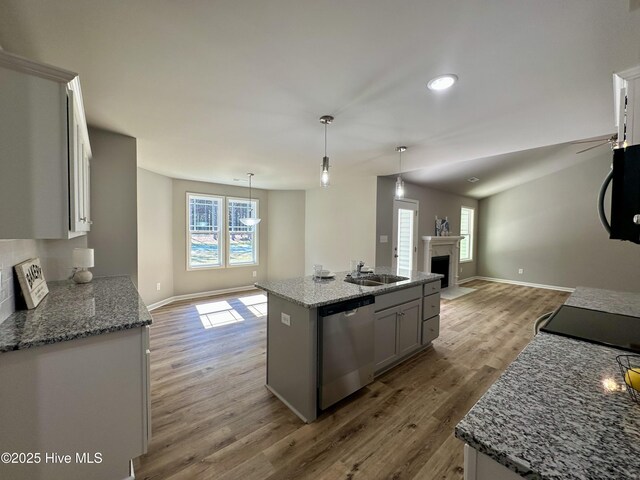 mudroom featuring baseboards and wood finished floors