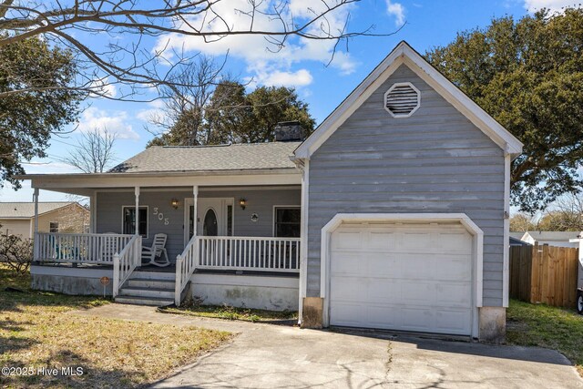 view of front of home with a chimney, roof with shingles, and a porch