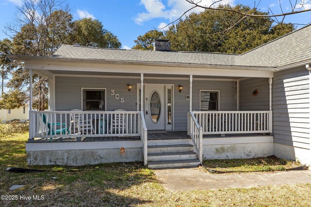 rear view of property featuring a fenced backyard and a deck