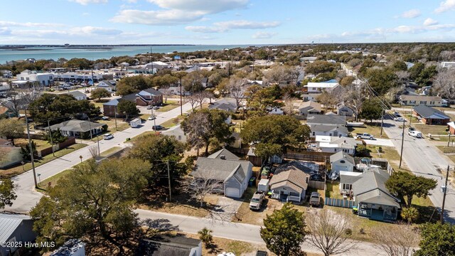 bird's eye view featuring a water view and a residential view